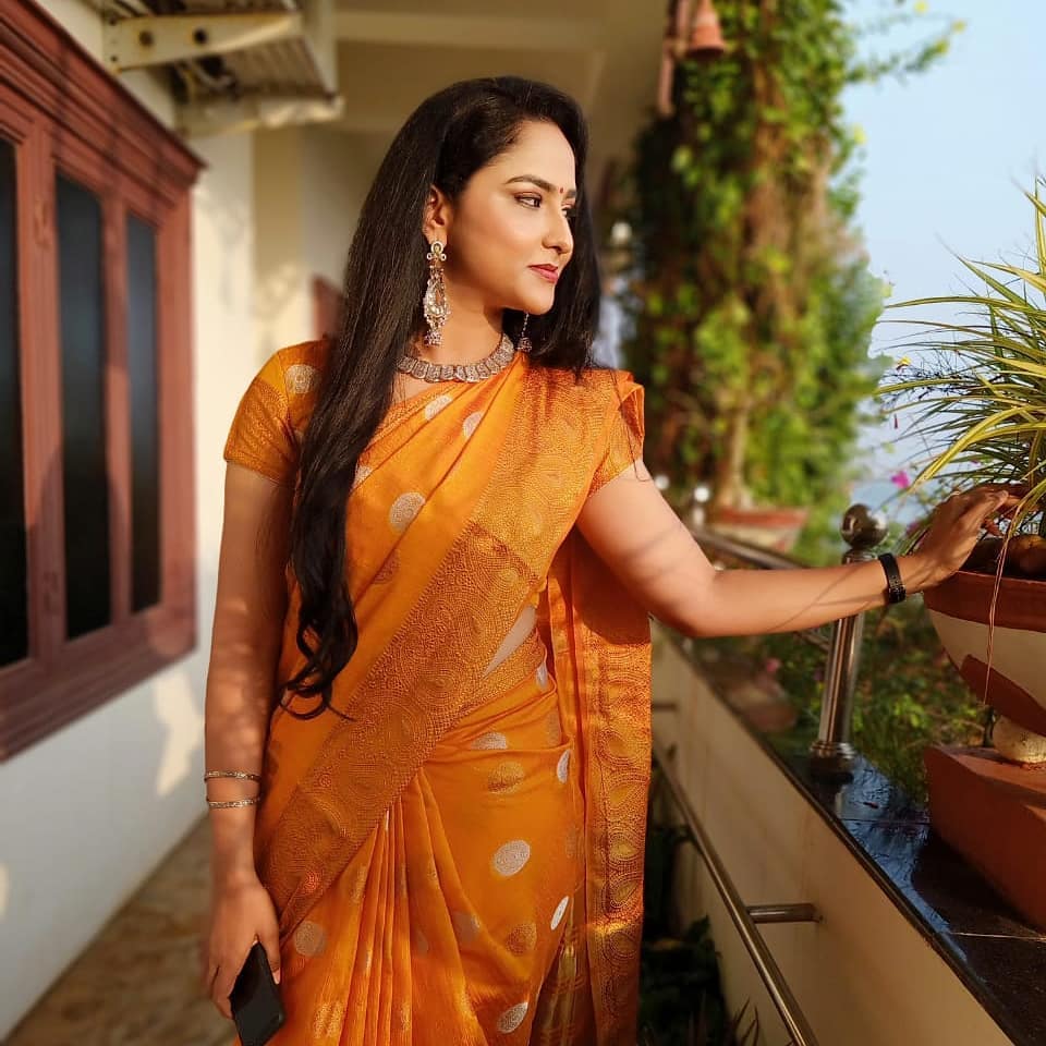 Telugu Tv Anchor Kasi Annapurna Stills in Orange Saree